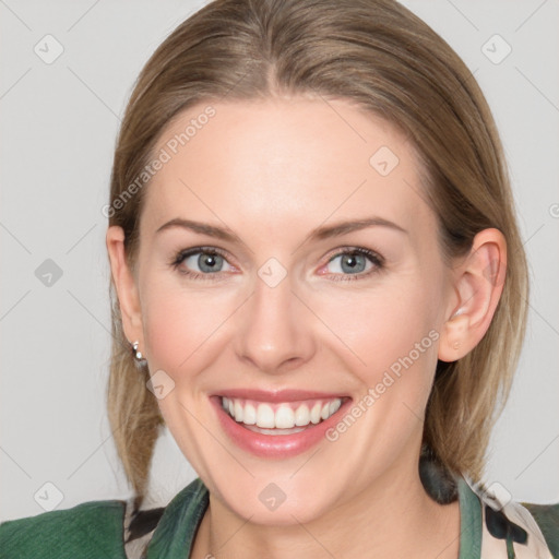 Joyful white young-adult female with medium  brown hair and blue eyes