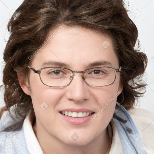 Joyful white adult female with medium  brown hair and blue eyes