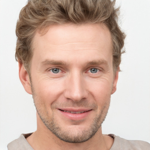 Joyful white adult male with short  brown hair and grey eyes