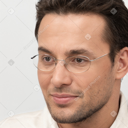 Joyful white adult male with short  brown hair and brown eyes