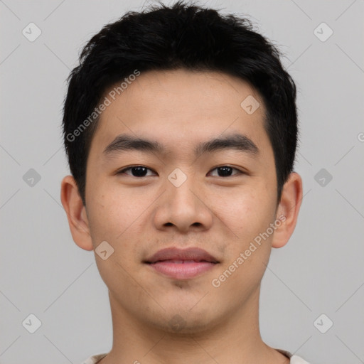 Joyful asian young-adult male with short  black hair and brown eyes