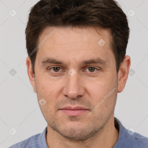 Joyful white adult male with short  brown hair and brown eyes