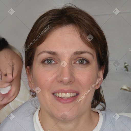 Joyful white young-adult female with medium  brown hair and blue eyes