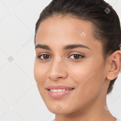 Joyful white young-adult female with long  brown hair and brown eyes