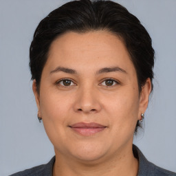 Joyful white adult female with medium  brown hair and brown eyes