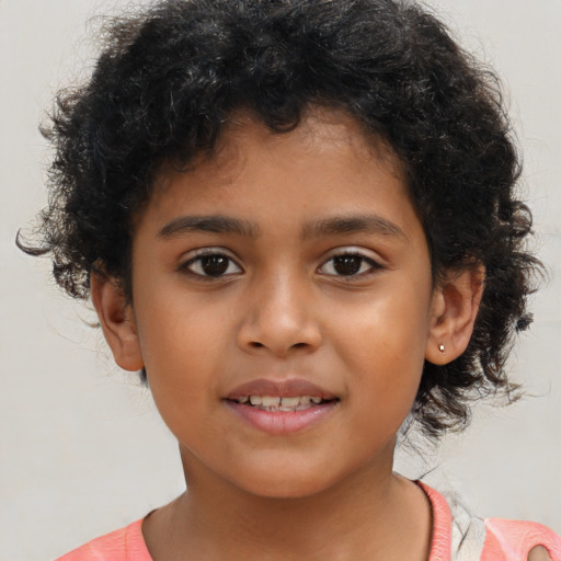Joyful latino child female with short  brown hair and brown eyes