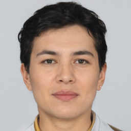 Joyful asian young-adult male with short  black hair and brown eyes