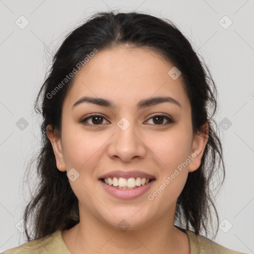 Joyful latino young-adult female with medium  brown hair and brown eyes