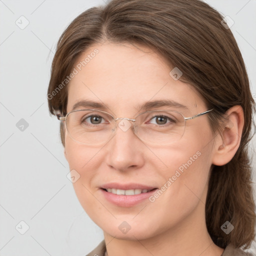 Joyful white adult female with medium  brown hair and grey eyes