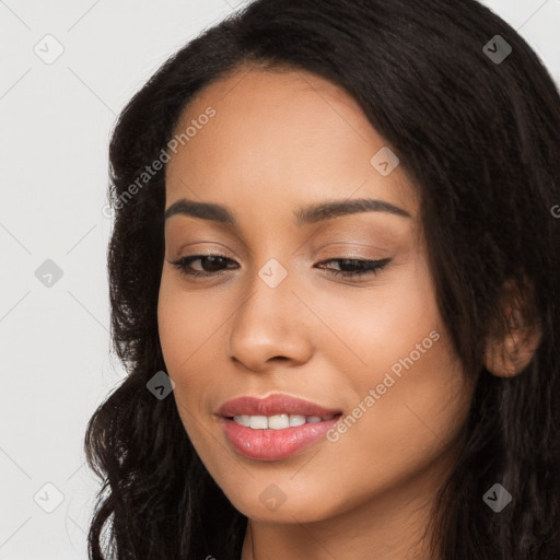 Joyful latino young-adult female with long  brown hair and brown eyes