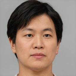 Neutral asian young-adult male with short  brown hair and brown eyes