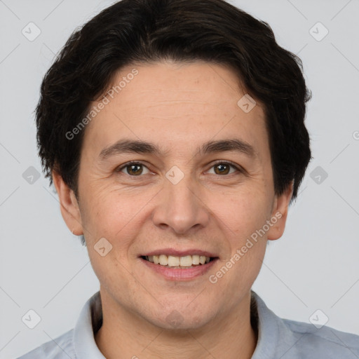 Joyful white adult male with short  brown hair and brown eyes