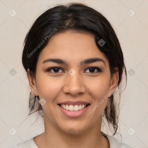 Joyful latino young-adult female with medium  brown hair and brown eyes