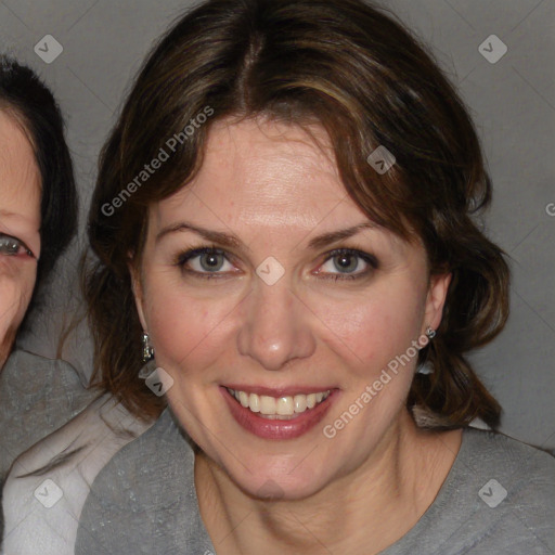 Joyful white adult female with medium  brown hair and blue eyes