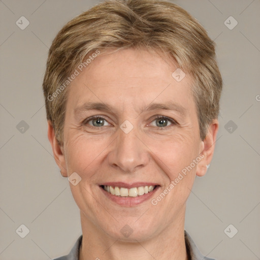 Joyful white adult female with short  brown hair and grey eyes