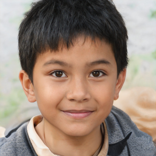 Joyful asian child male with short  brown hair and brown eyes