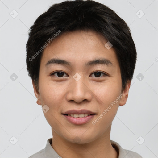 Joyful asian young-adult male with short  brown hair and brown eyes