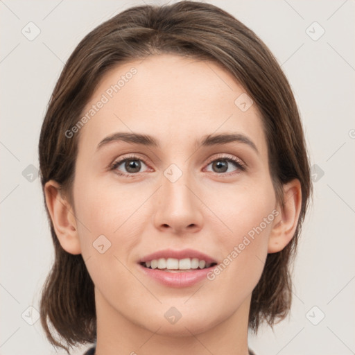 Joyful white young-adult female with medium  brown hair and brown eyes