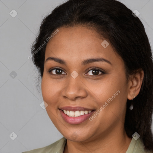 Joyful latino young-adult female with medium  brown hair and brown eyes