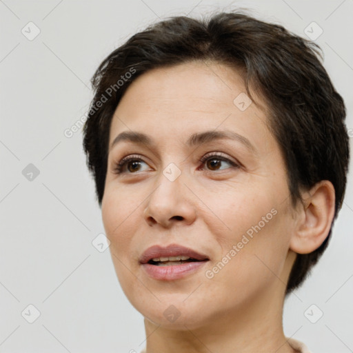 Joyful white adult female with short  brown hair and brown eyes