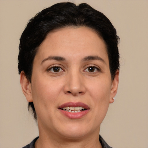 Joyful white adult female with short  brown hair and brown eyes