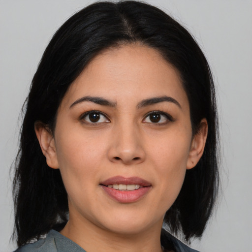 Joyful asian young-adult female with medium  black hair and brown eyes