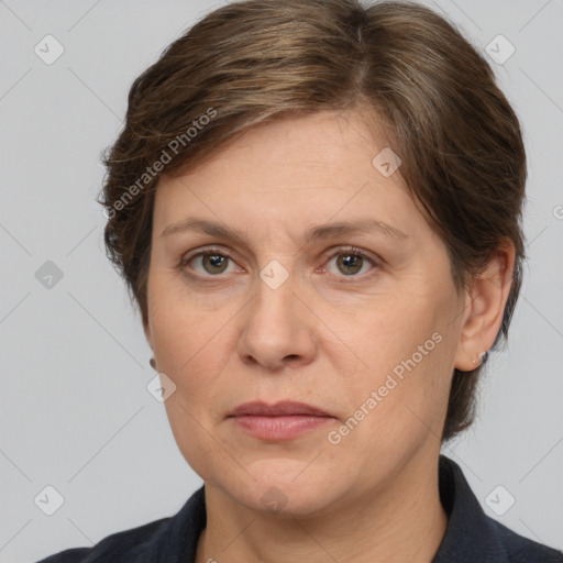 Joyful white adult female with medium  brown hair and grey eyes