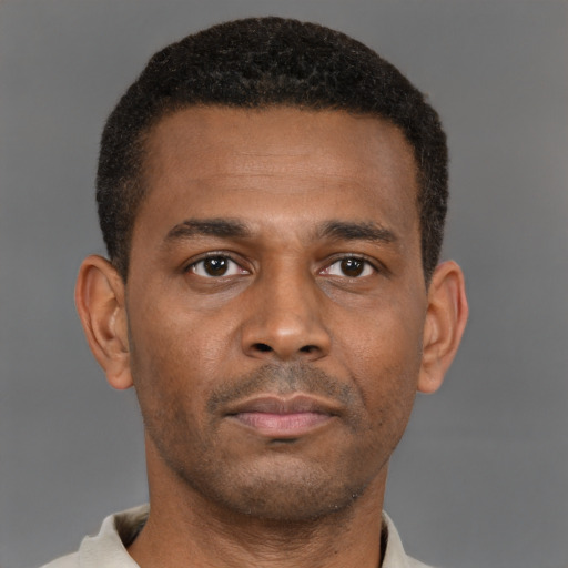 Neutral latino young-adult male with short  brown hair and brown eyes