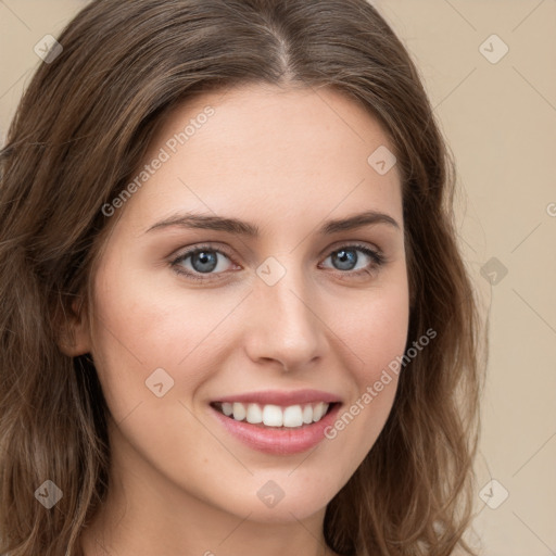 Joyful white young-adult female with long  brown hair and green eyes