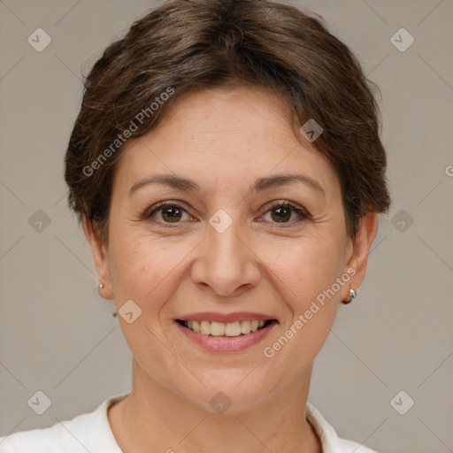 Joyful white adult female with short  brown hair and brown eyes