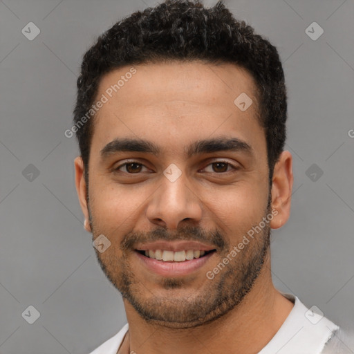 Joyful latino young-adult male with short  black hair and brown eyes