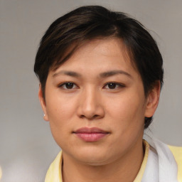 Joyful asian young-adult female with short  brown hair and brown eyes