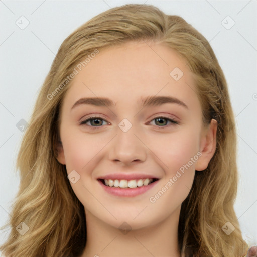 Joyful white young-adult female with long  brown hair and blue eyes