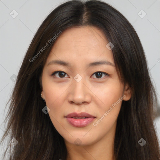 Joyful asian young-adult female with long  brown hair and brown eyes