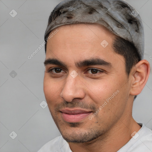 Joyful white young-adult male with short  black hair and brown eyes