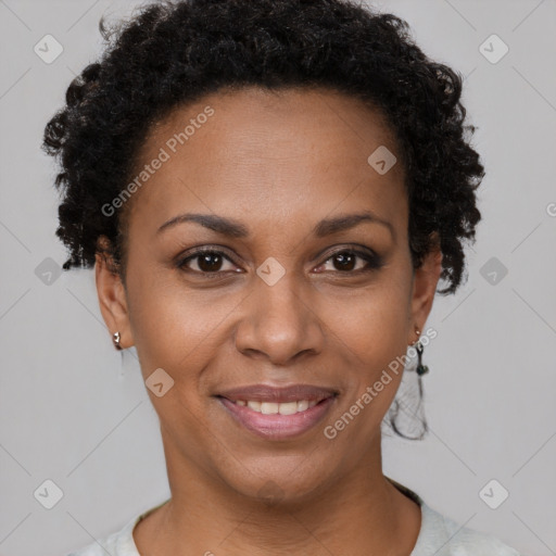 Joyful black adult female with short  brown hair and brown eyes