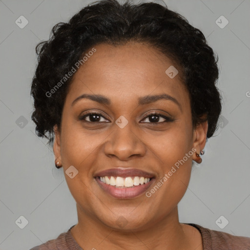 Joyful black young-adult female with short  brown hair and brown eyes