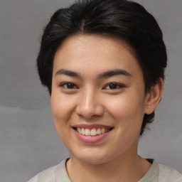 Joyful asian young-adult female with short  brown hair and brown eyes