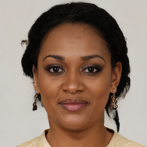 Joyful black young-adult female with medium  black hair and brown eyes