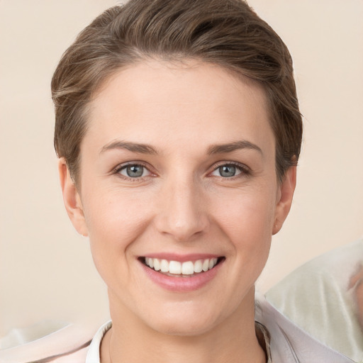 Joyful white young-adult female with short  brown hair and brown eyes