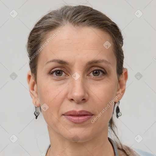 Joyful white adult female with short  brown hair and grey eyes