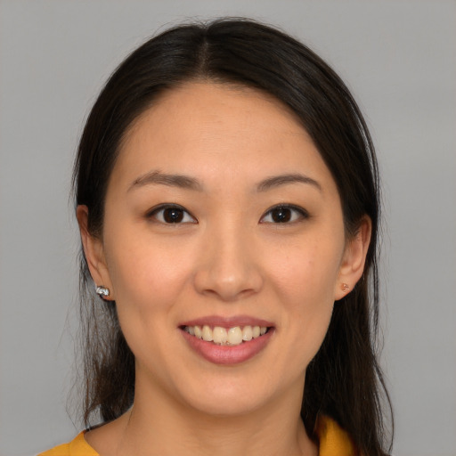 Joyful white young-adult female with medium  brown hair and brown eyes