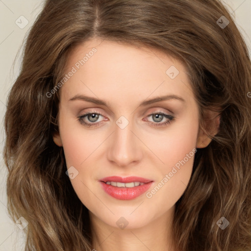 Joyful white young-adult female with long  brown hair and green eyes