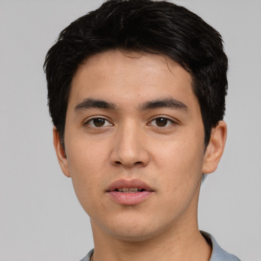 Neutral white young-adult male with short  black hair and brown eyes