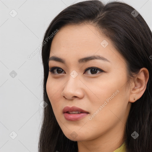 Joyful asian young-adult female with long  brown hair and brown eyes