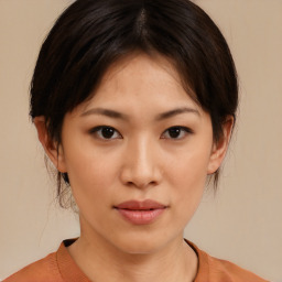 Neutral asian young-adult female with medium  brown hair and brown eyes