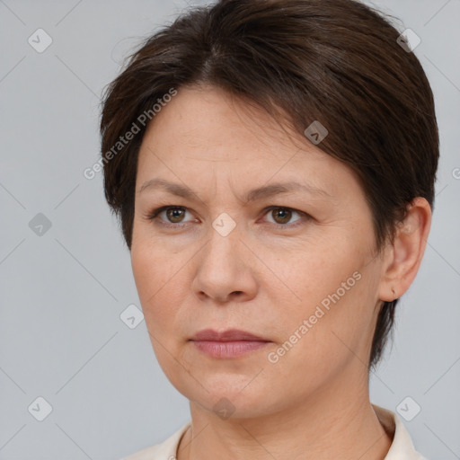 Joyful white adult female with short  brown hair and brown eyes