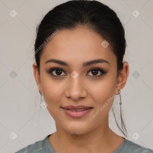 Joyful latino young-adult female with medium  brown hair and brown eyes