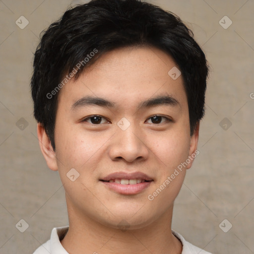 Joyful asian young-adult male with short  black hair and brown eyes