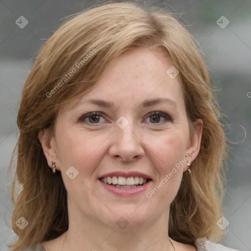 Joyful white adult female with medium  brown hair and grey eyes